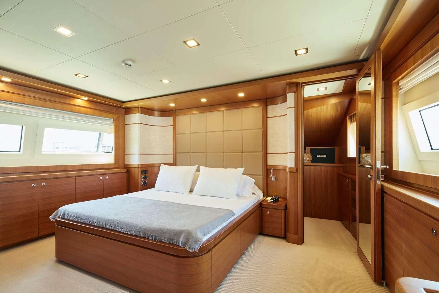 a bedroom with a bed and a closet aboard BEST OFF Yacht for Charter