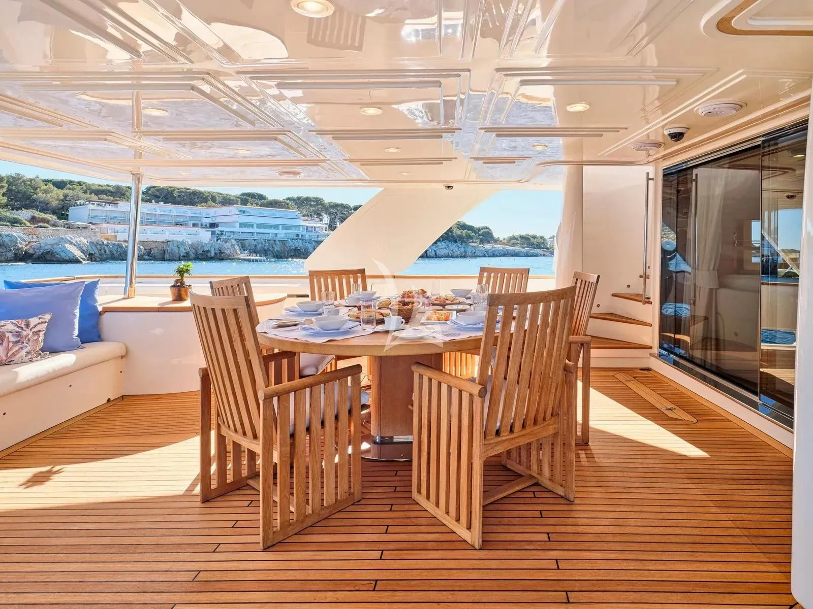 a table and chairs on a deck aboard BEST OFF Yacht for Charter