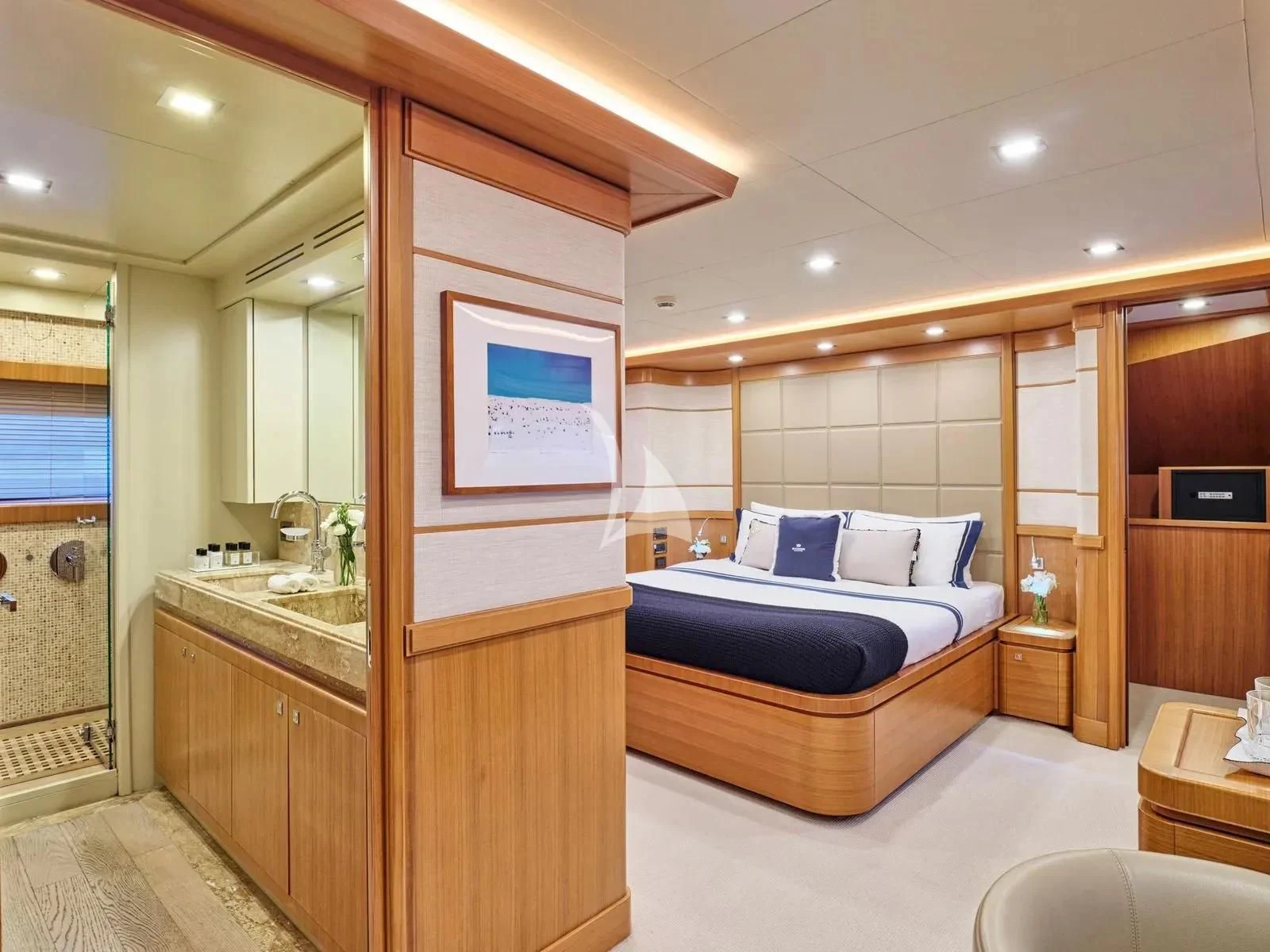 a bedroom with a bed and a desk aboard BEST OFF Yacht for Charter