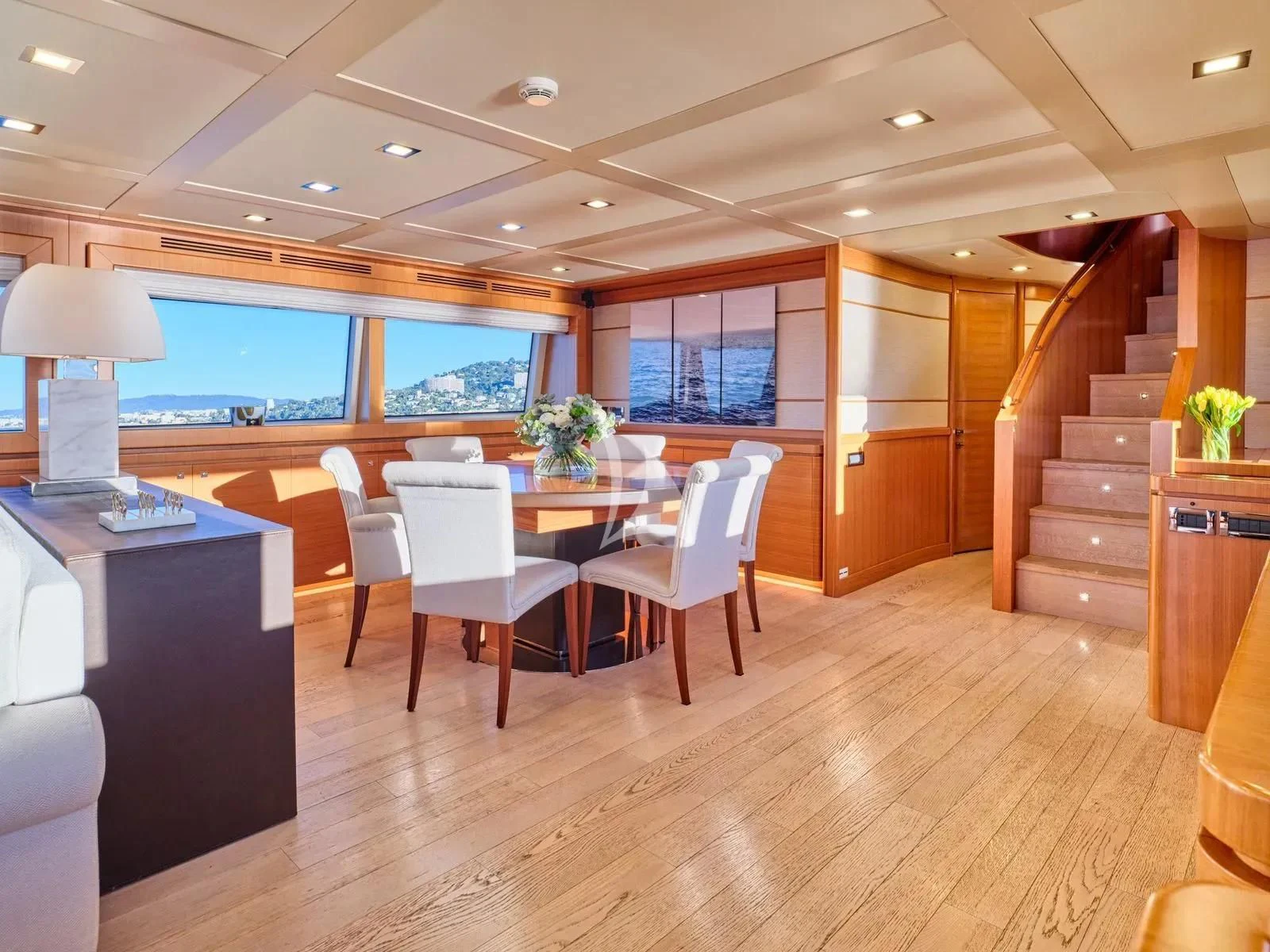 a room with a table and chairs aboard BEST OFF Yacht for Charter