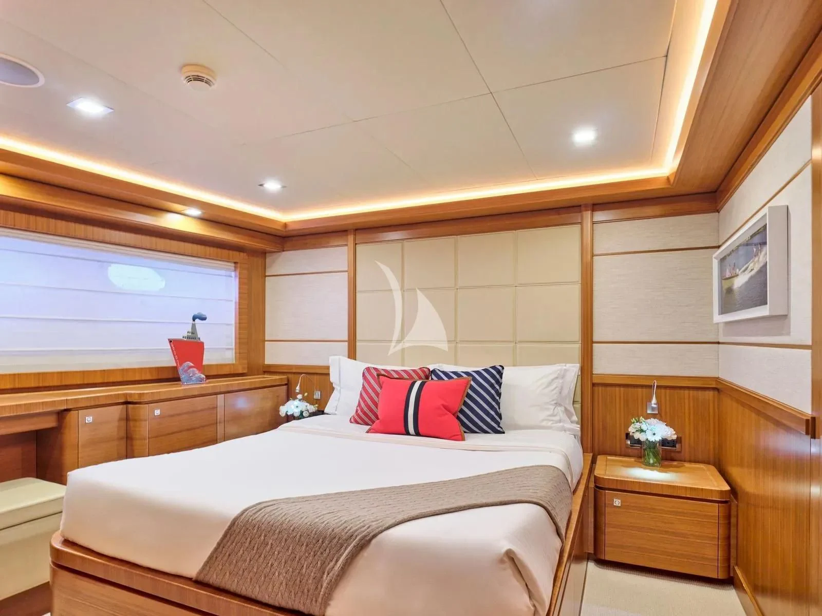 a bedroom with a bed and a window aboard BEST OFF Yacht for Charter