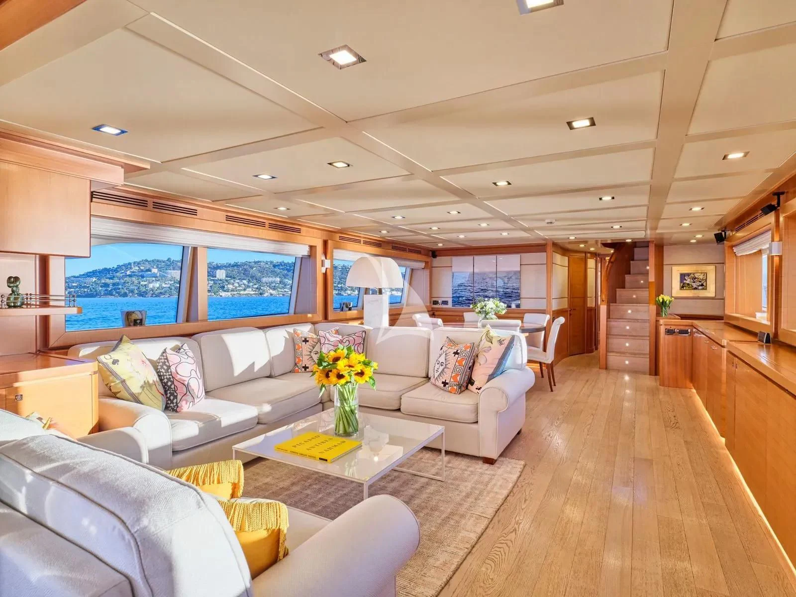 a living room with a wood floor aboard BEST OFF Yacht for Charter