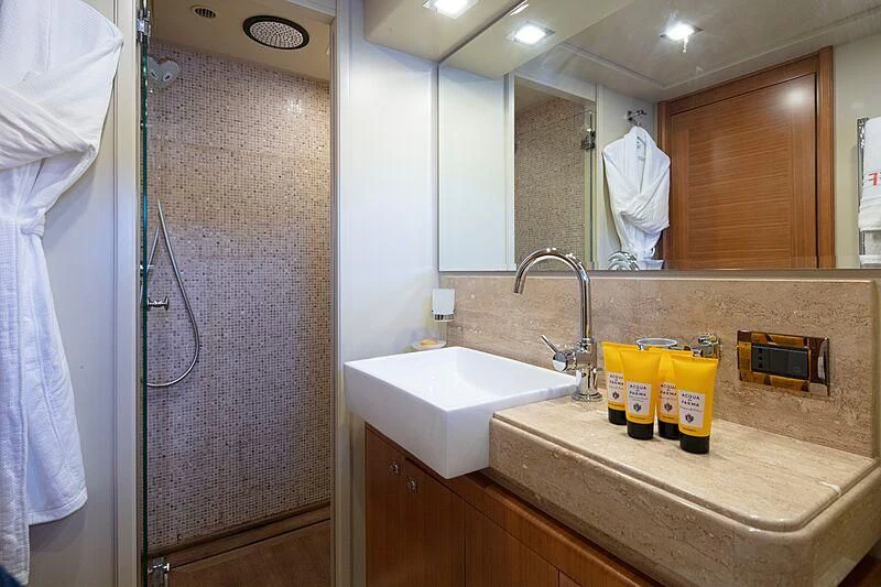 a bathroom with a sink and a mirror aboard BEST OFF Yacht for Charter