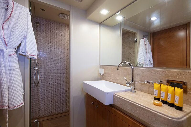 a bathroom with a sink and a mirror aboard BEST OFF Yacht for Charter