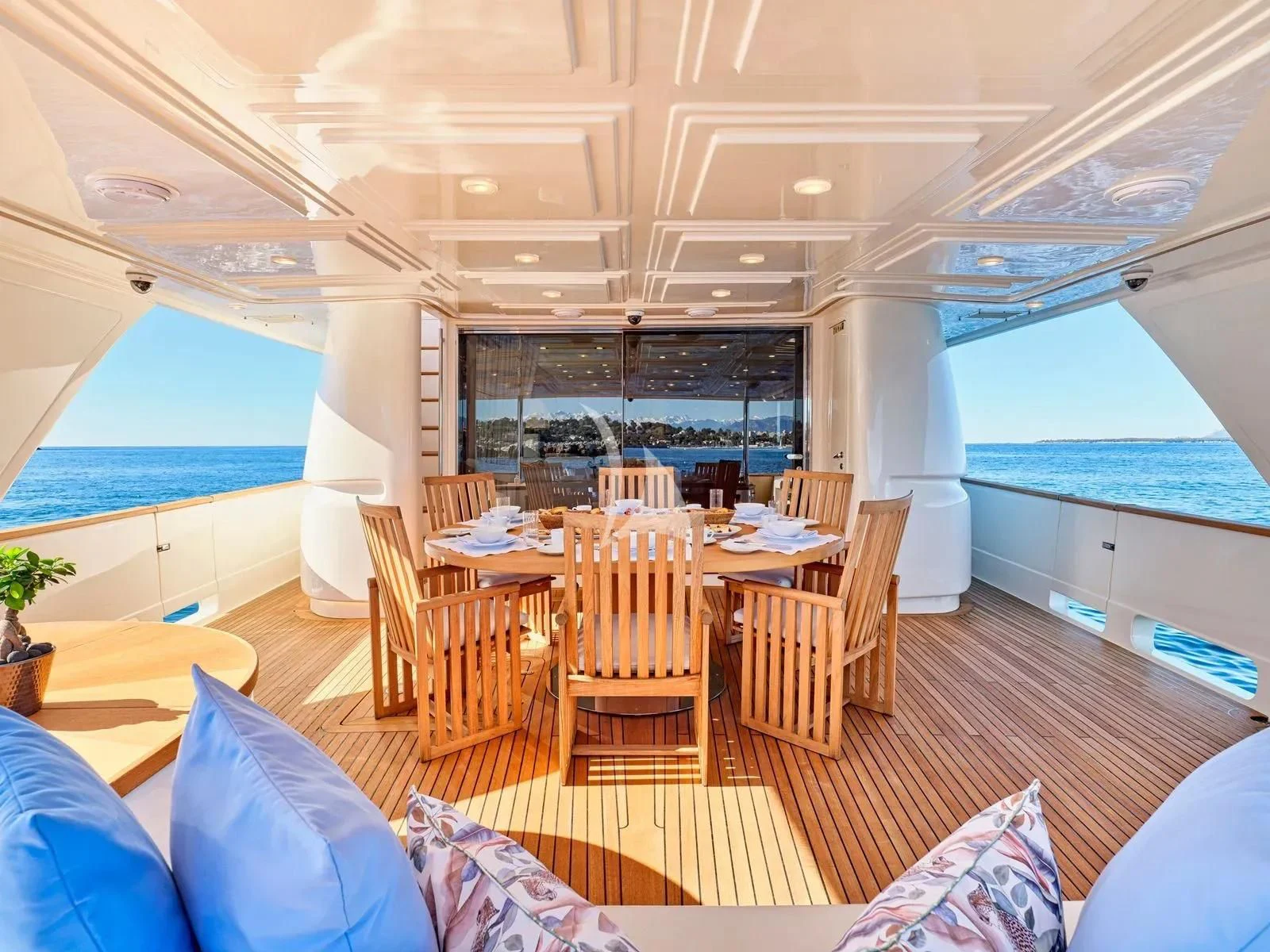 a room with tables and chairs aboard BEST OFF Yacht for Charter