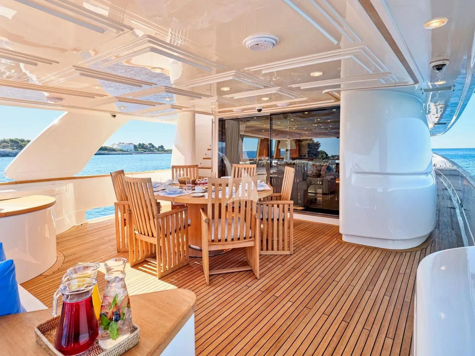 a room with tables and chairs aboard BEST OFF Yacht for Charter