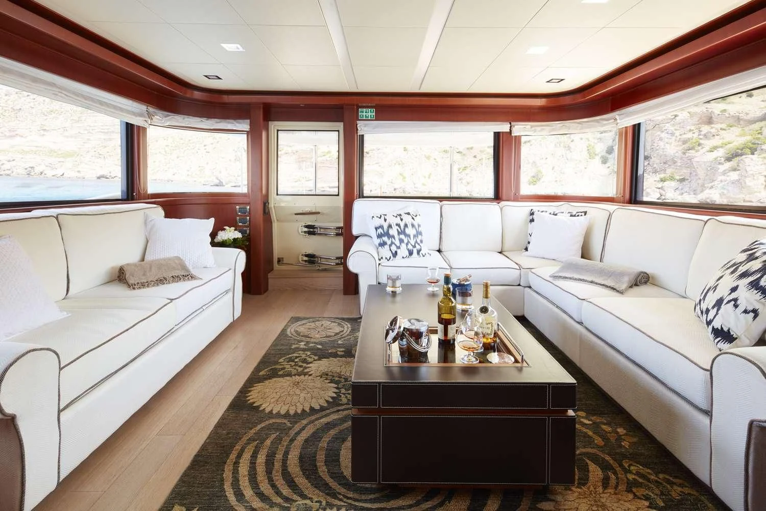 a living room with a couch and a coffee table aboard BEST OFF Yacht for Charter