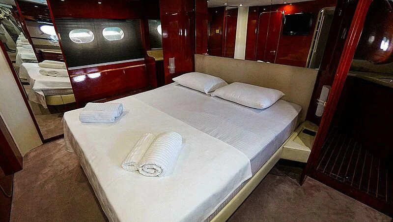 a bed in a room aboard BONA DEA Yacht for Sale