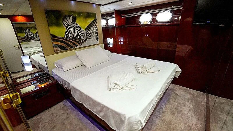 a bed in a room aboard BONA DEA Yacht for Sale