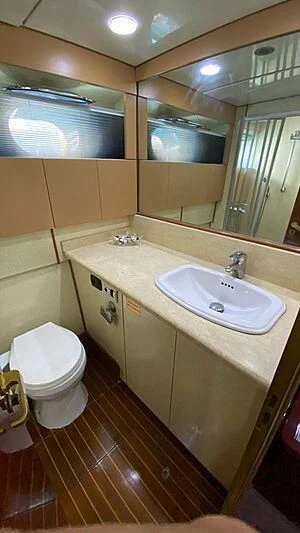a bathroom with a sink and a toilet aboard BONA DEA Yacht for Sale