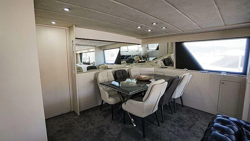 a conference room with a table and chairs aboard BONA DEA Yacht for Sale