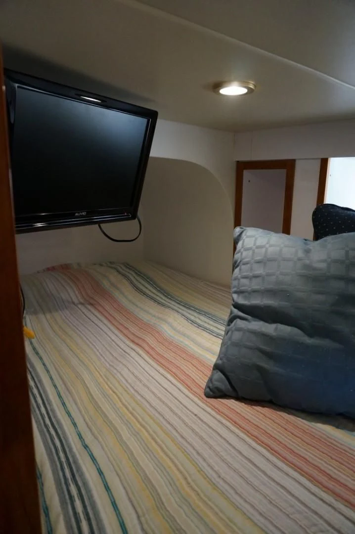 a bed with pillows aboard SWEET LADY Yacht for Sale
