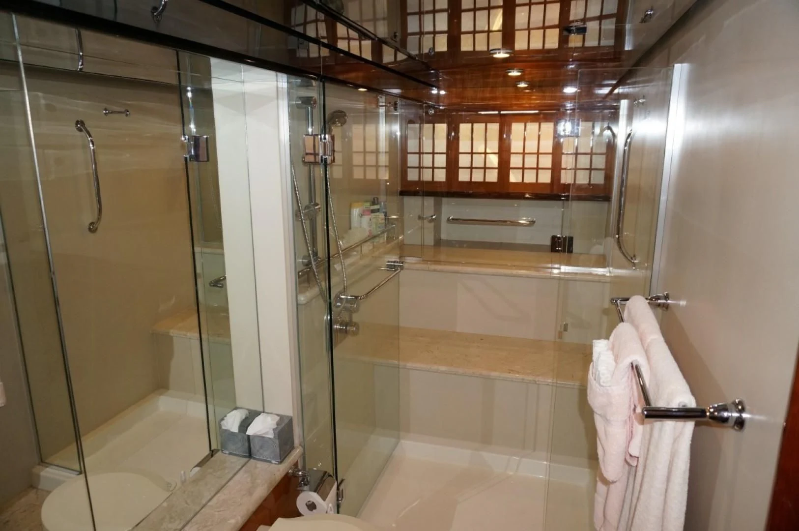 a bathroom with a glass shower aboard SWEET LADY Yacht for Sale