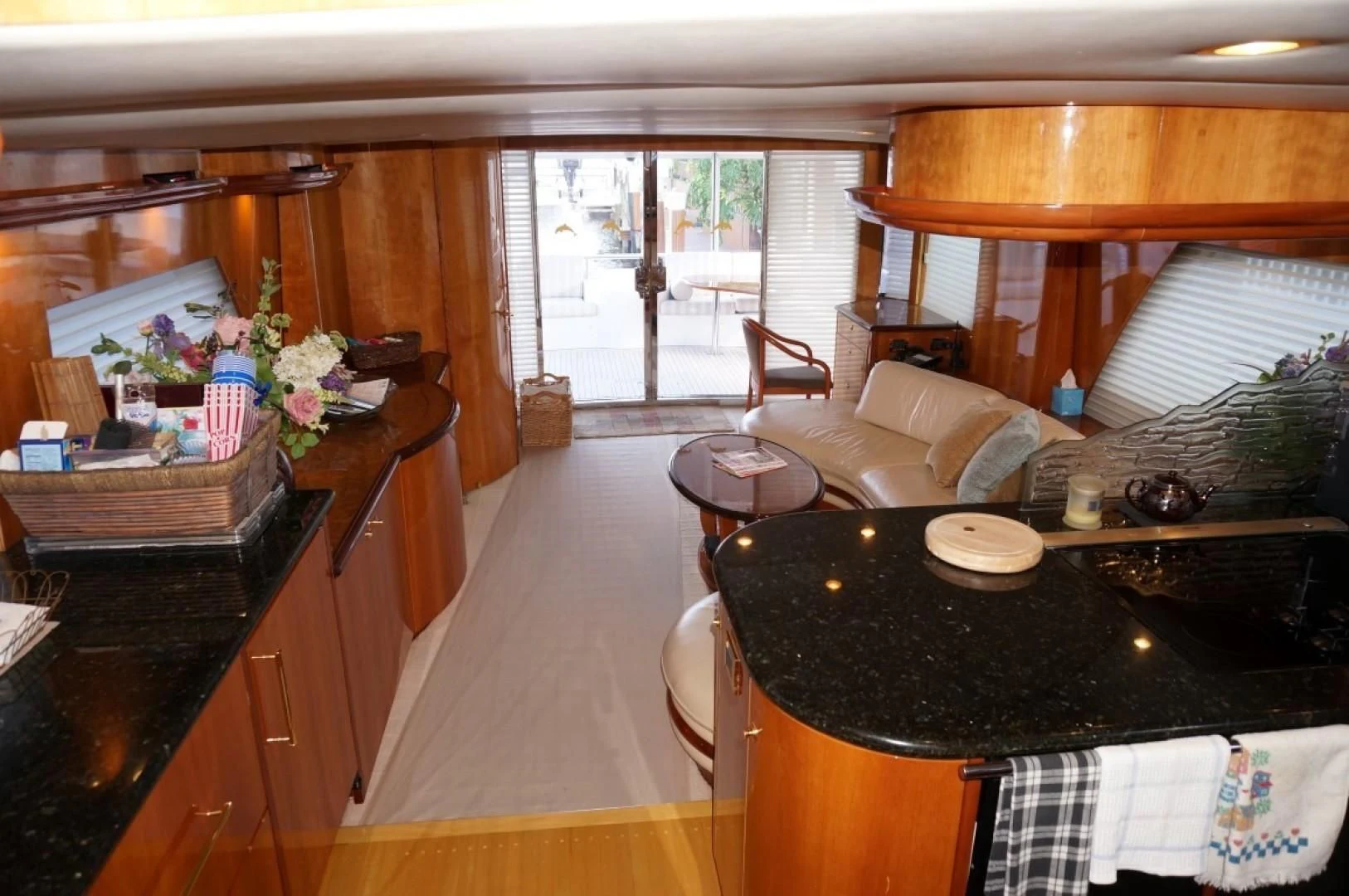 a kitchen with a table and chairs aboard SWEET LADY Yacht for Sale