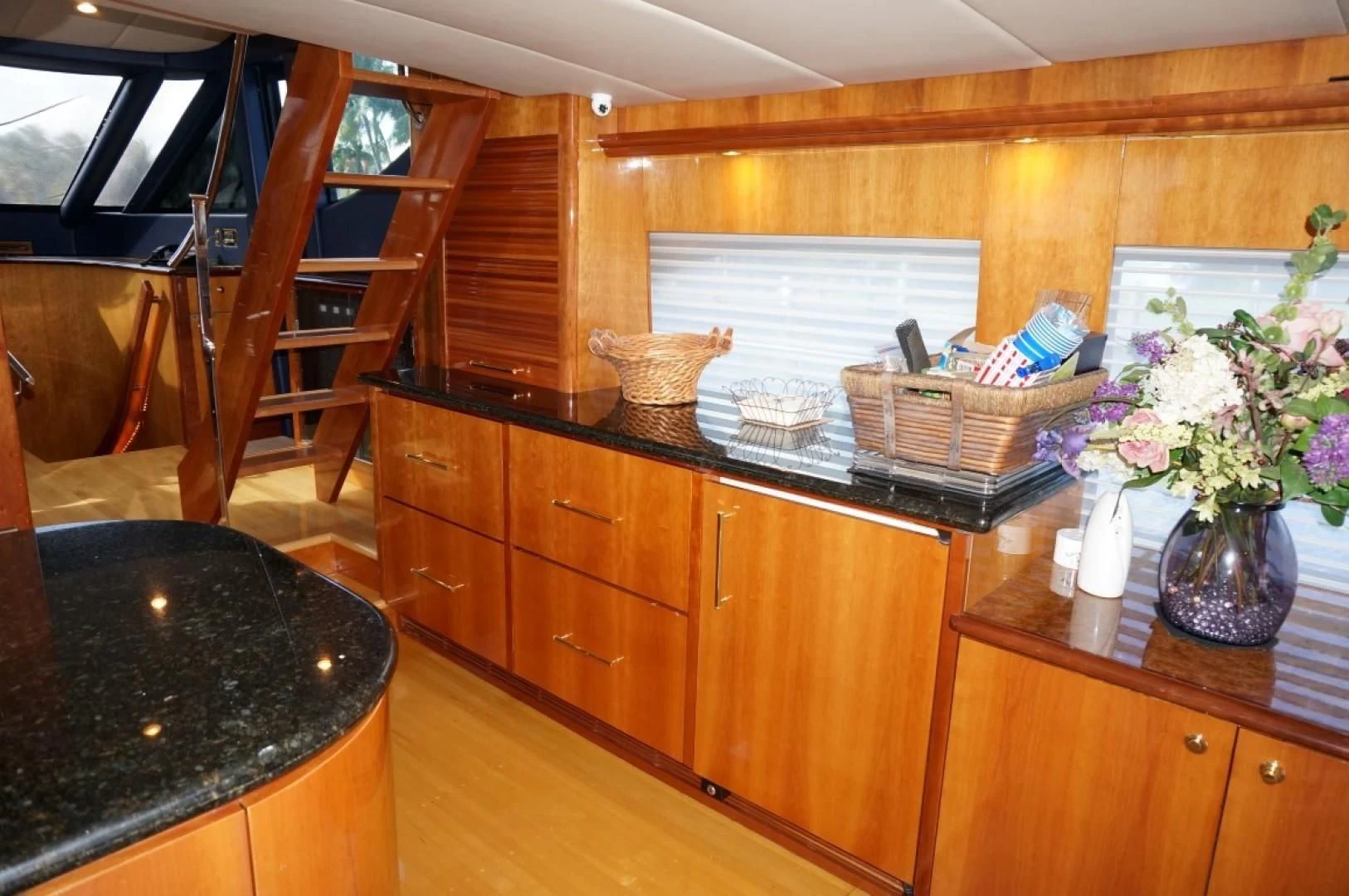a kitchen with wooden cabinets aboard SWEET LADY Yacht for Sale