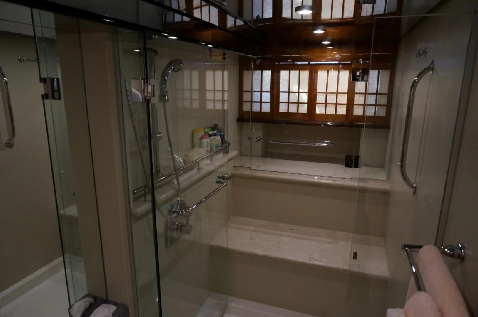 a bathroom with a glass shower aboard SWEET LADY Yacht for Sale