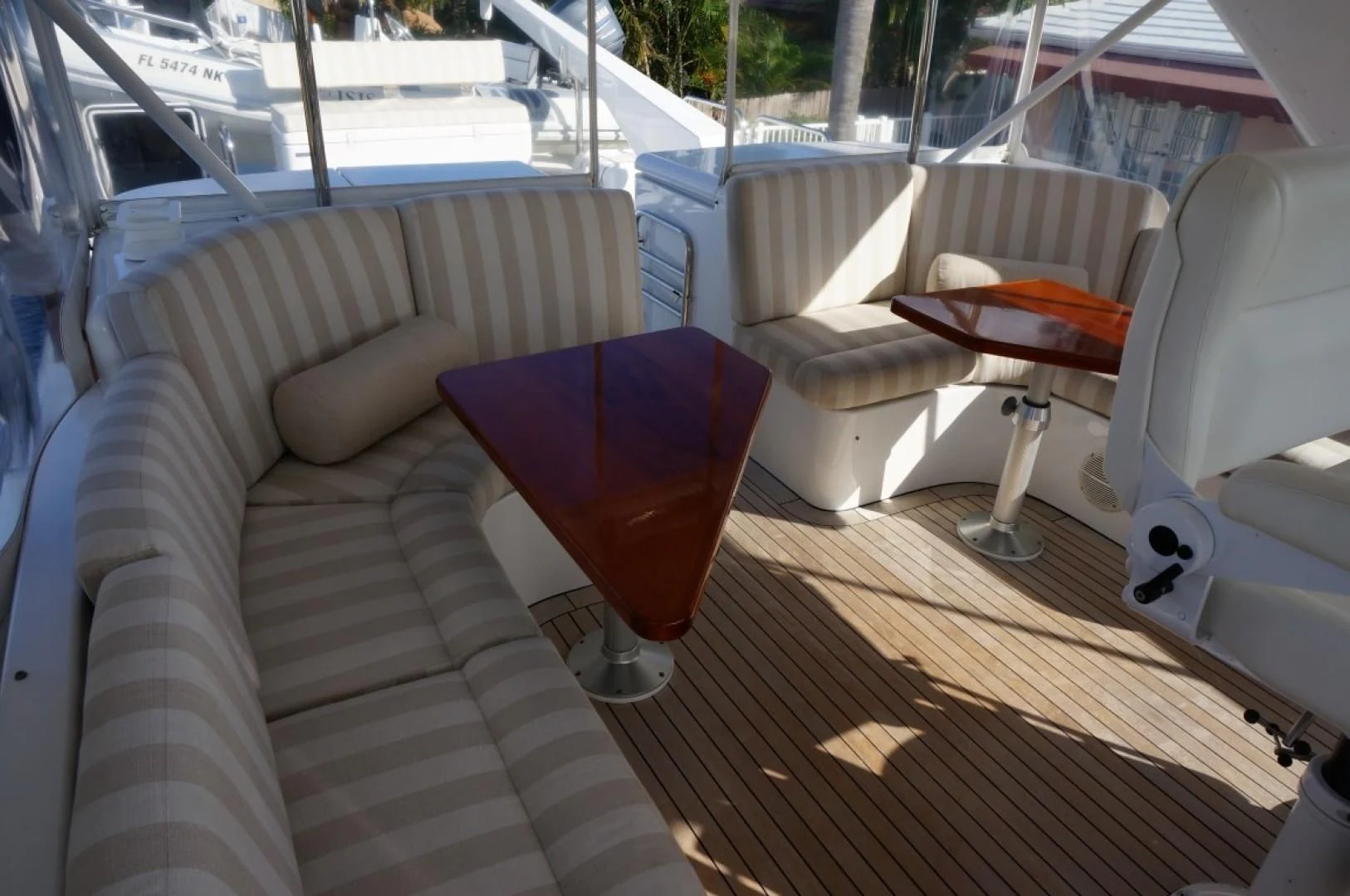 a glass of red wine on a deck aboard SWEET LADY Yacht for Sale