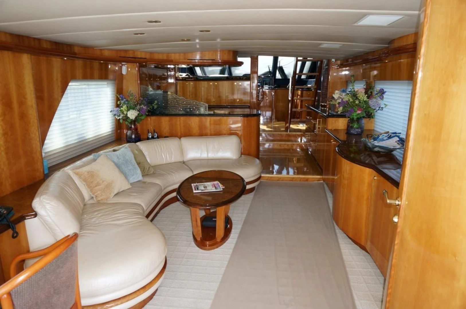 a living room with a couch and coffee table aboard SWEET LADY Yacht for Sale
