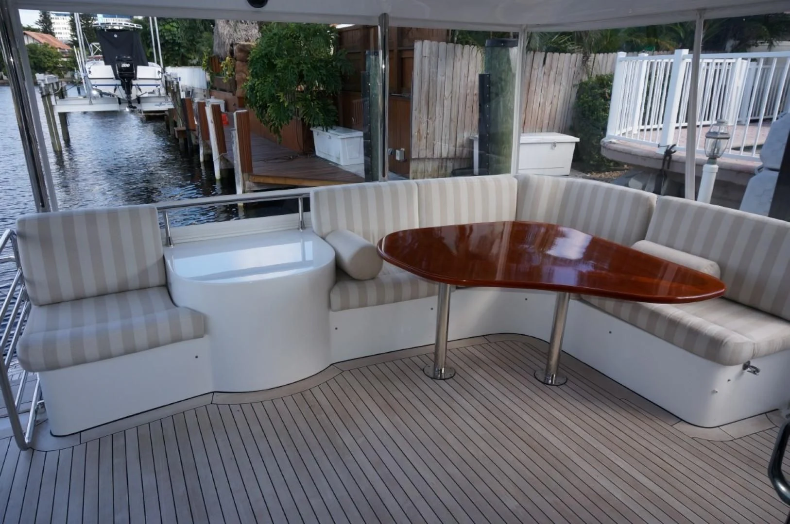 a table and chairs outside of a house aboard SWEET LADY Yacht for Sale