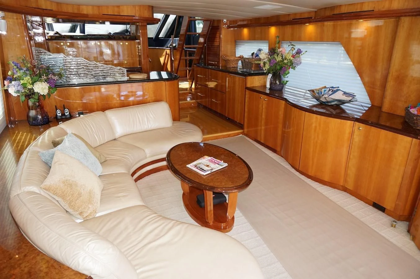 a living room with a couch and coffee table aboard SWEET LADY Yacht for Sale