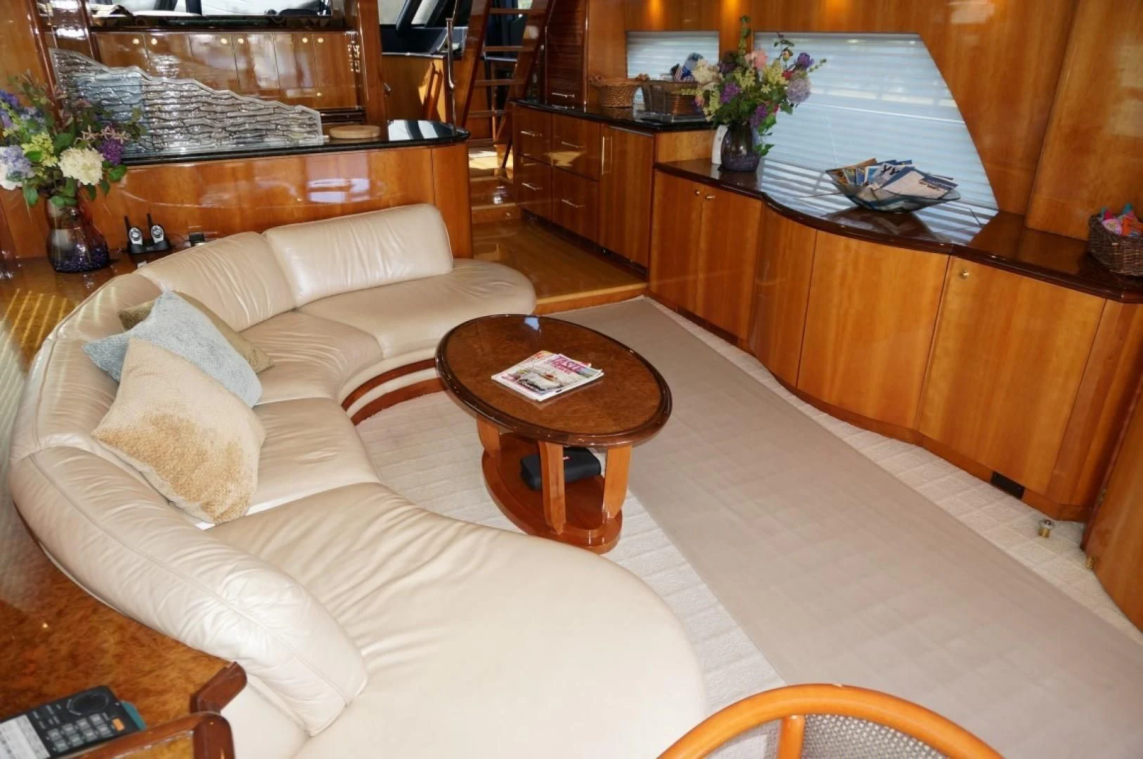 a living room with a couch and a coffee table aboard SWEET LADY Yacht for Sale