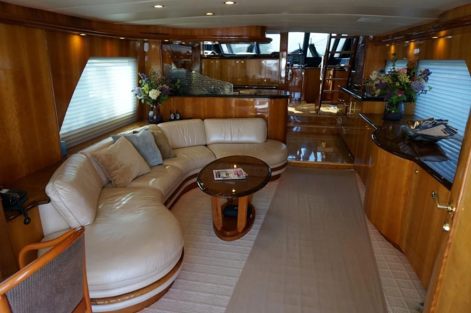 a living room with a couch and a coffee table aboard SWEET LADY Yacht for Sale