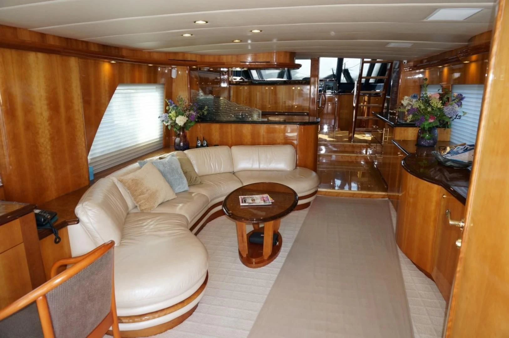 a living room with a couch and a coffee table aboard SWEET LADY Yacht for Sale