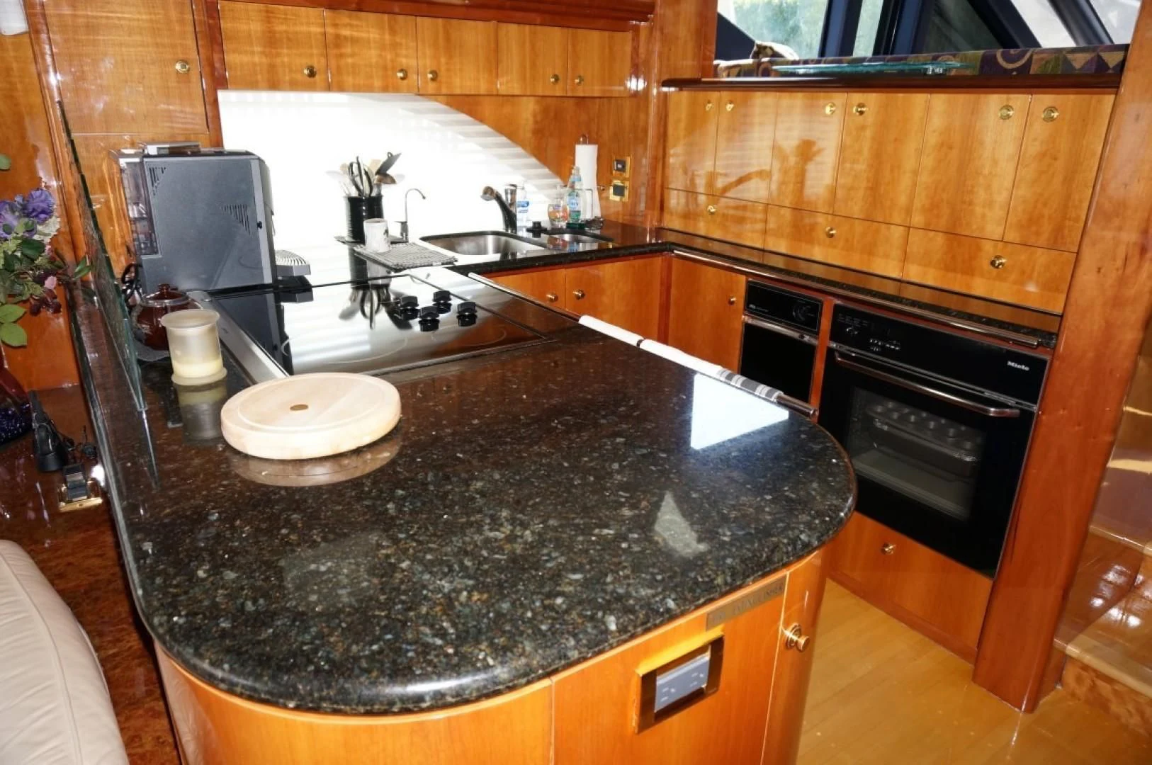 a kitchen with a black counter top aboard SWEET LADY Yacht for Sale