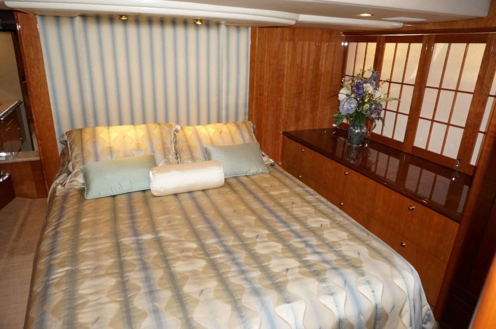 a bed with a flowered bed aboard SWEET LADY Yacht for Sale