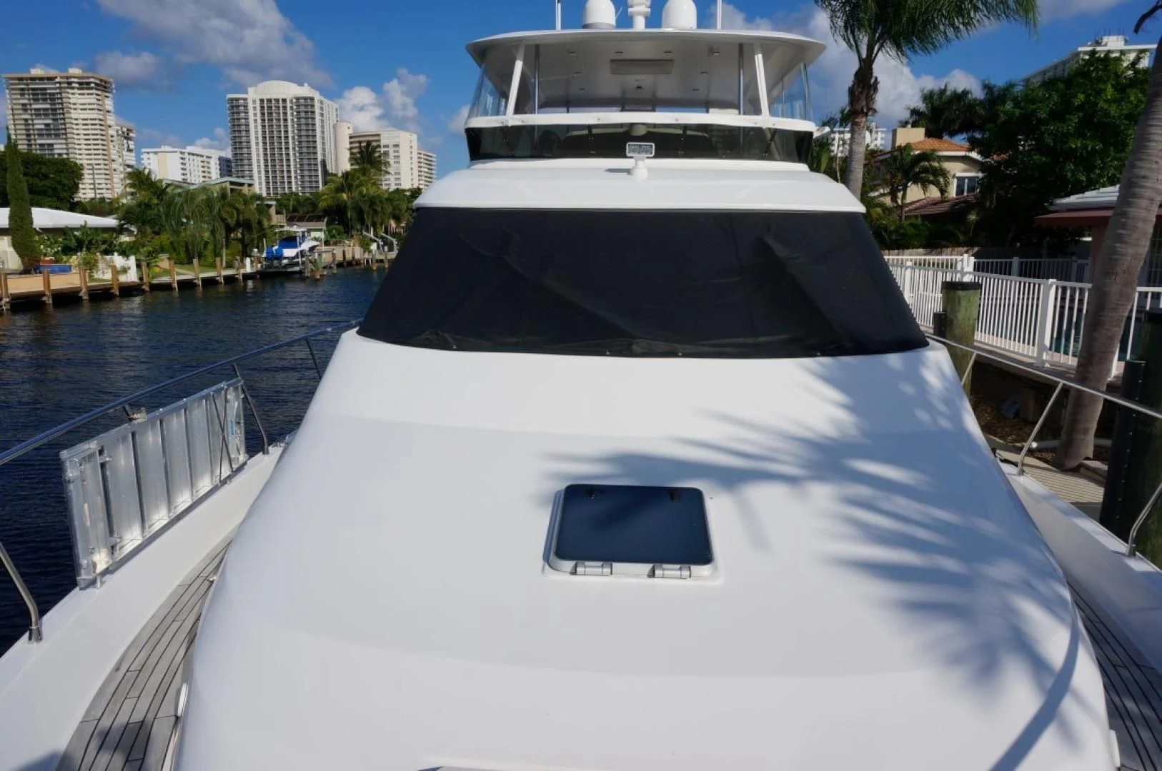 a white boat on a dock aboard SWEET LADY Yacht for Sale