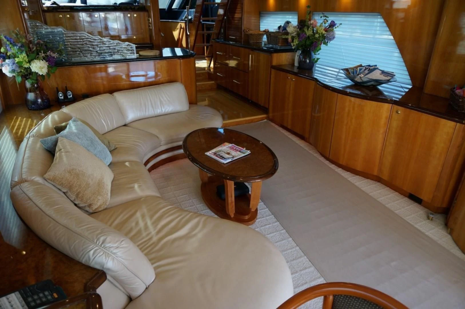 a living room with a couch and a coffee table aboard SWEET LADY Yacht for Sale