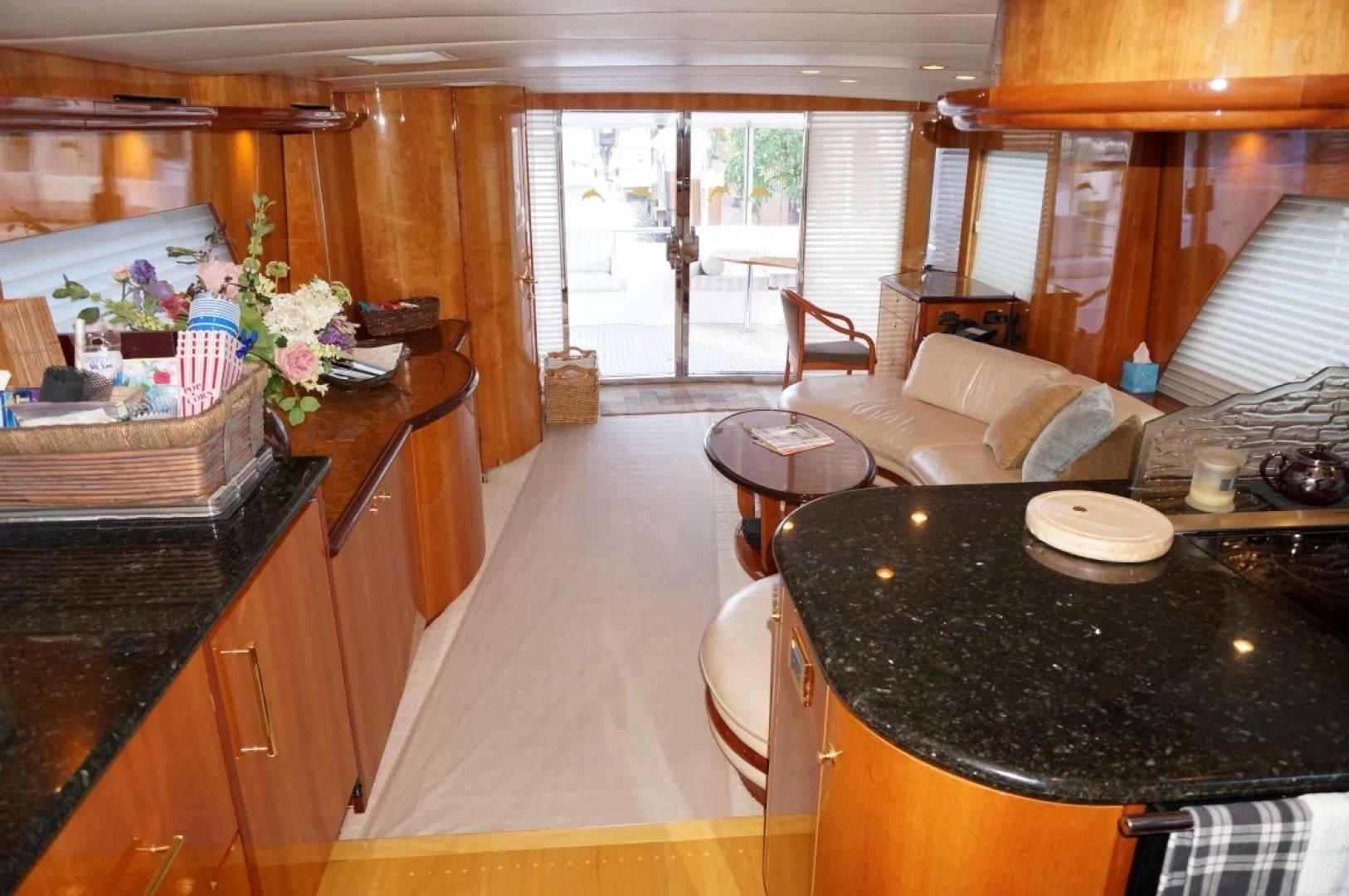 a kitchen with a dining table aboard SWEET LADY Yacht for Sale