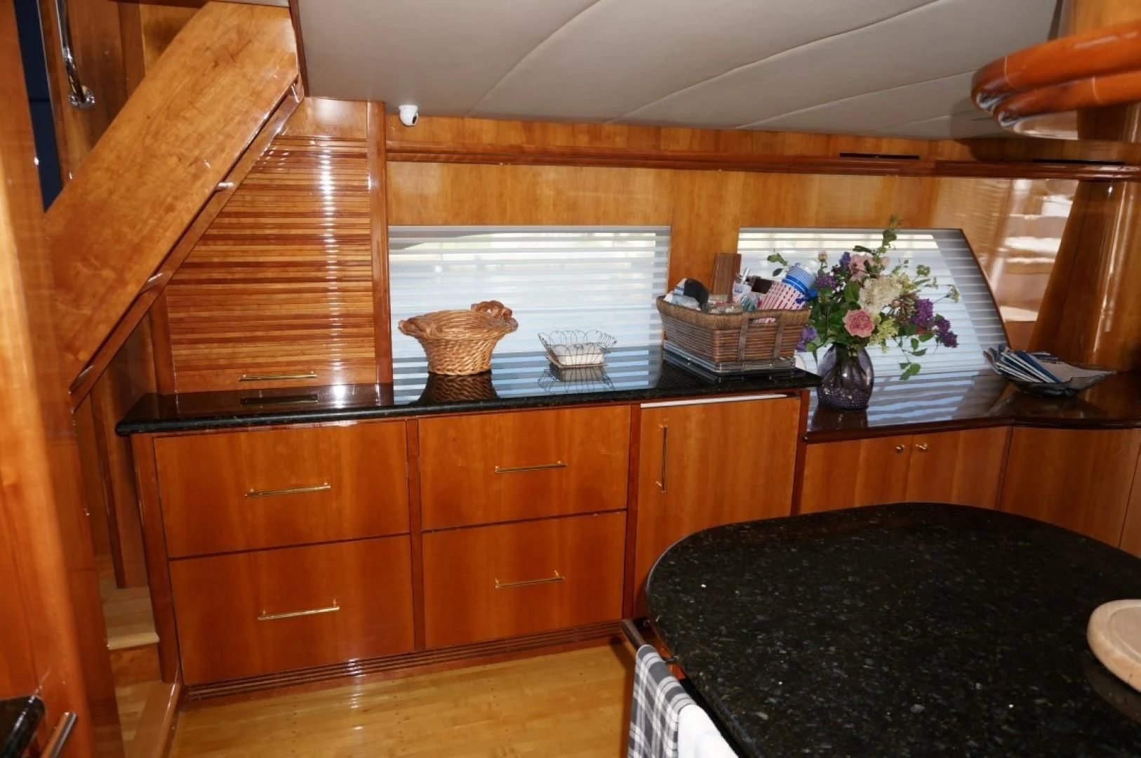 a kitchen with wooden cabinets aboard SWEET LADY Yacht for Sale