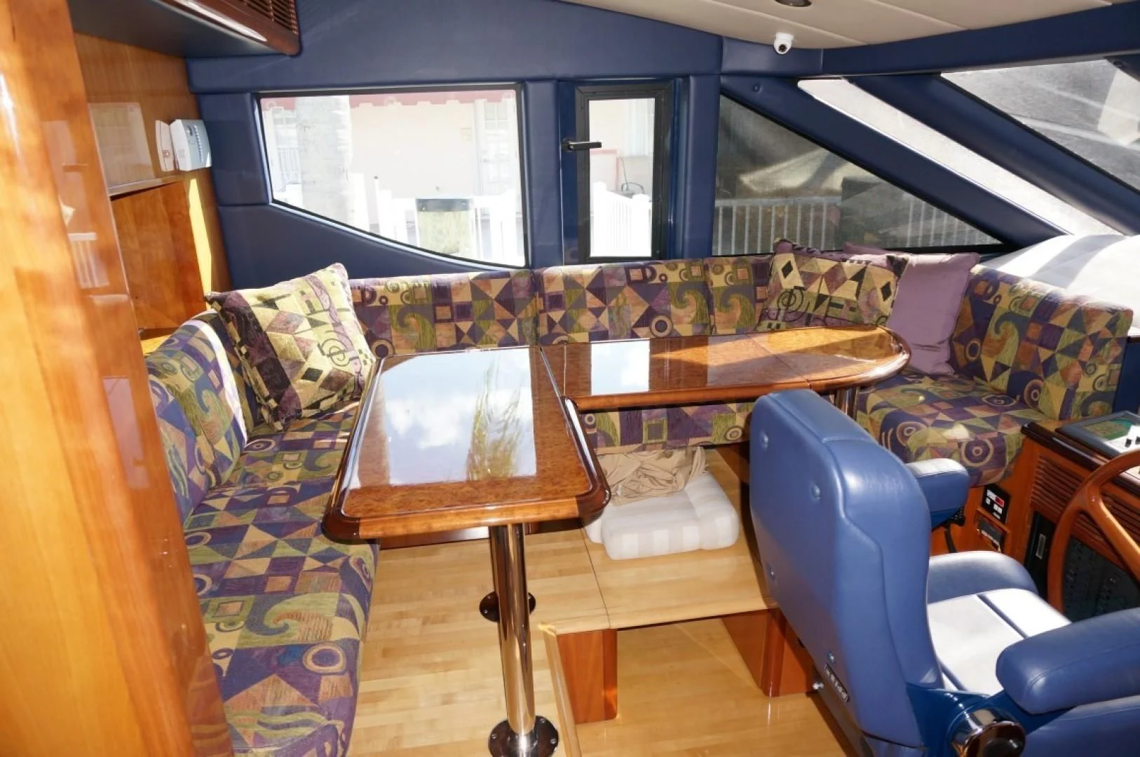 a room with a table and chairs aboard SWEET LADY Yacht for Sale