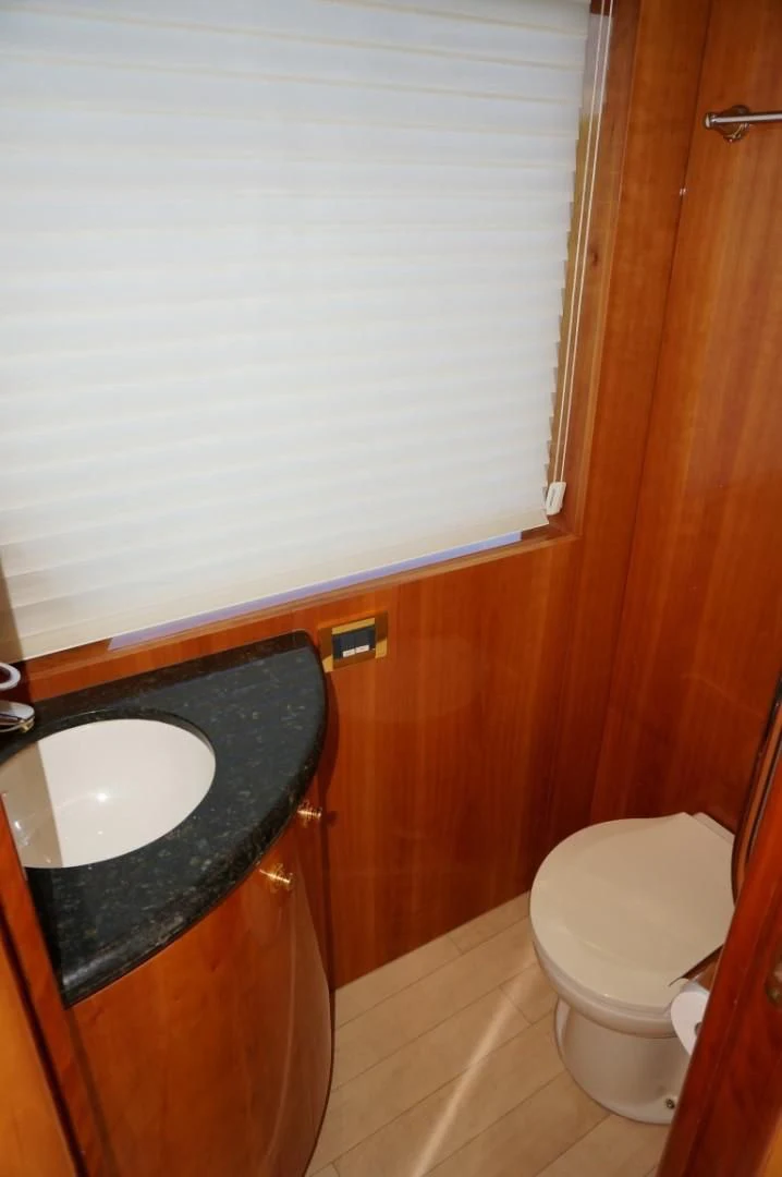 a bathroom with a sink and toilet aboard SWEET LADY Yacht for Sale