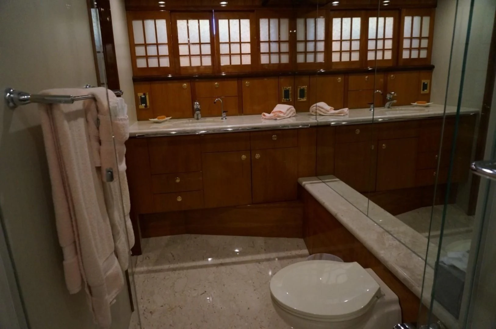 a bathroom with a toilet and a sink aboard SWEET LADY Yacht for Sale