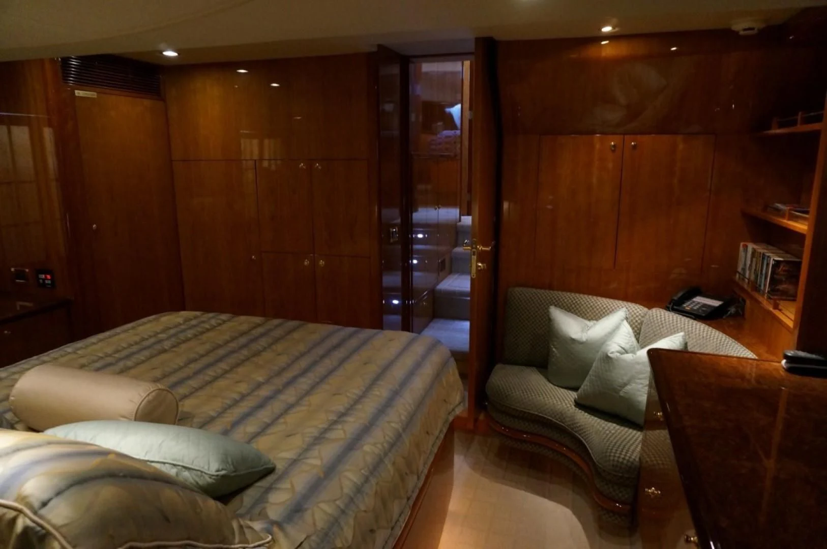 a room with a bed and a chair aboard SWEET LADY Yacht for Sale