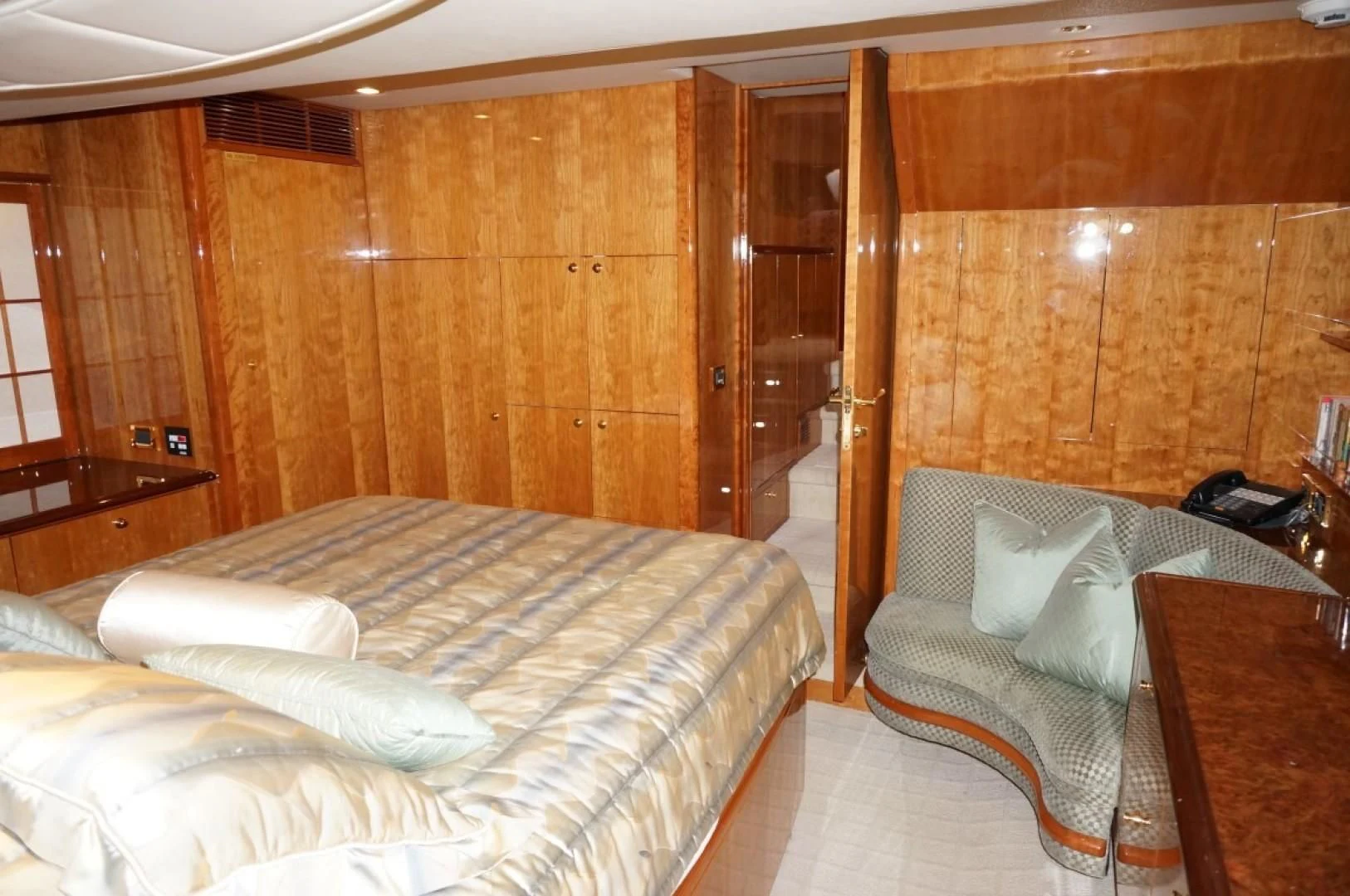 a room with a bed and a wood wall aboard SWEET LADY Yacht for Sale