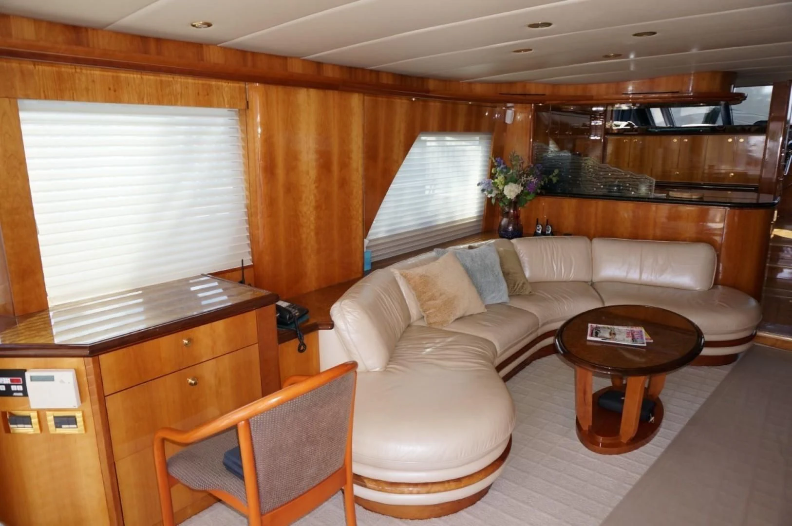 a living room with a couch and a table aboard SWEET LADY Yacht for Sale