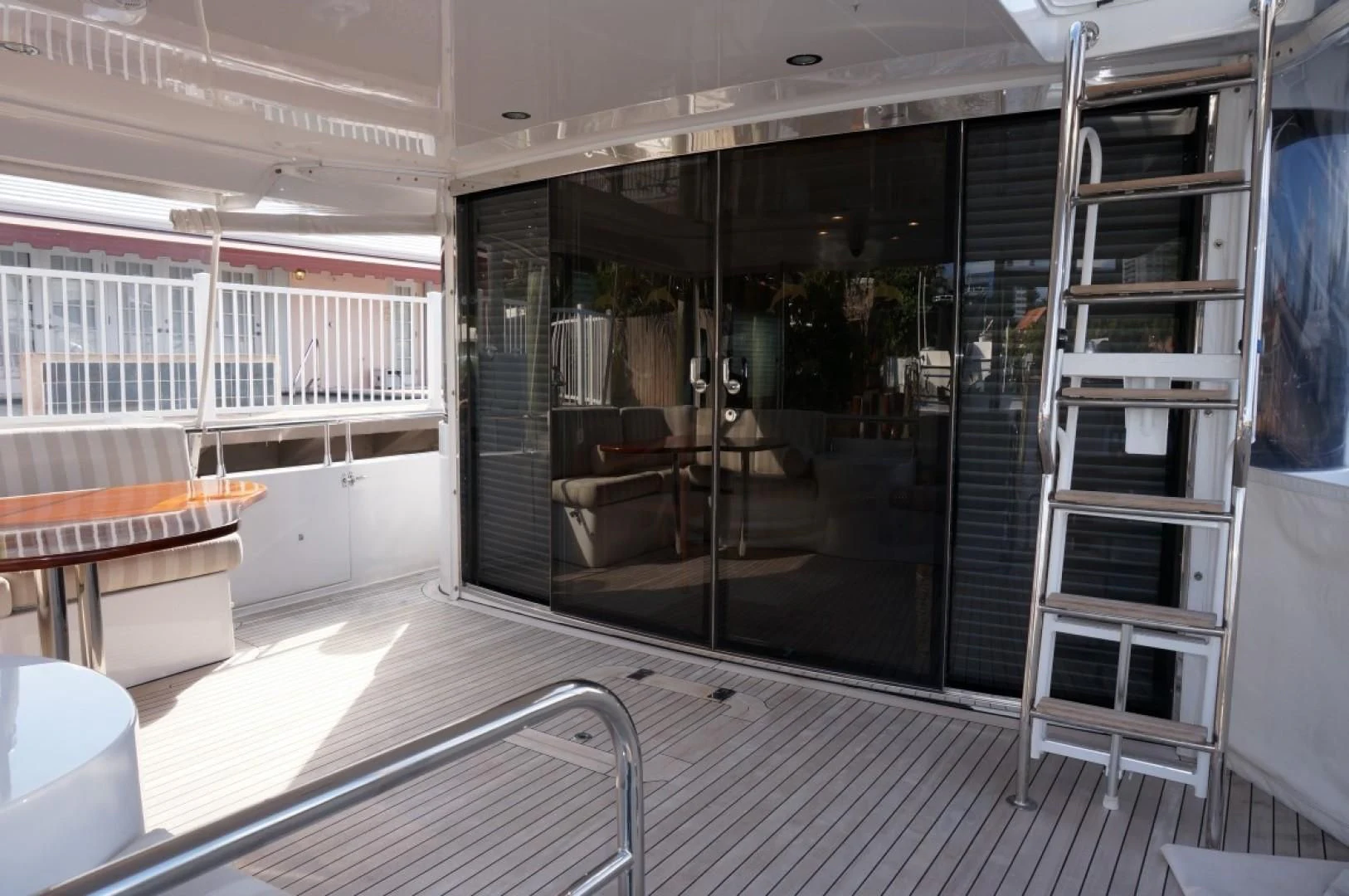a room with a glass door and a glass wall aboard SWEET LADY Yacht for Sale