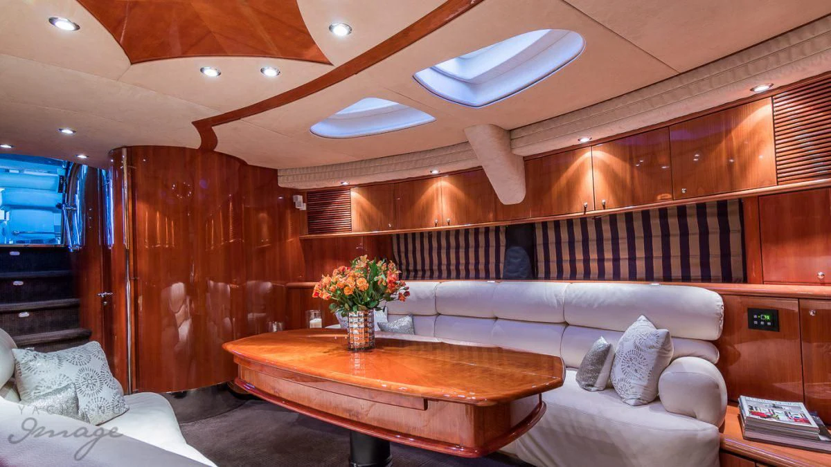 a living room with a couch and a table aboard H2 Yacht for Sale