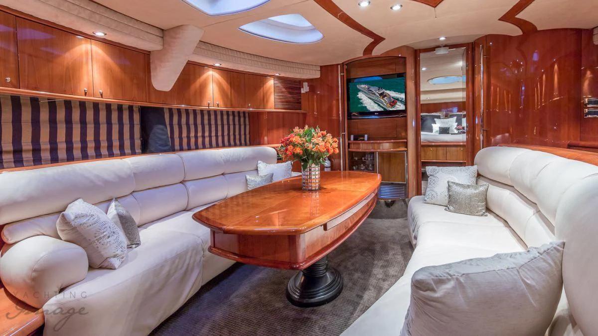 a living room with a couch and a coffee table aboard H2 Yacht for Sale
