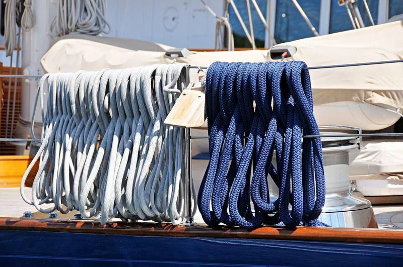 a group of blue ties from a rack aboard ALEJANDRA Yacht for Sale