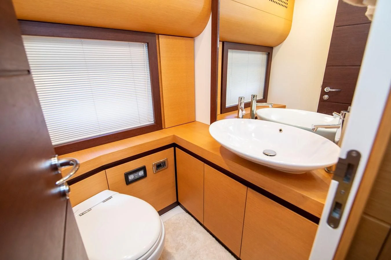 a bathroom with a sink and a toilet aboard UPTOWN GIRL Yacht for Sale
