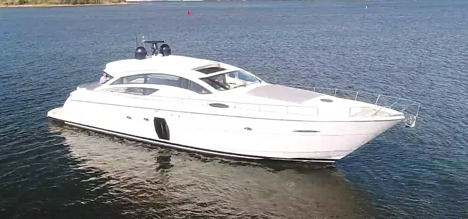 a white yacht on the water aboard UPTOWN GIRL Yacht for Sale