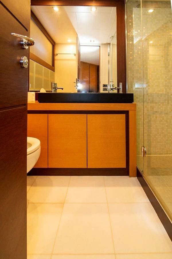 a bathroom with a large mirror aboard UPTOWN GIRL Yacht for Sale