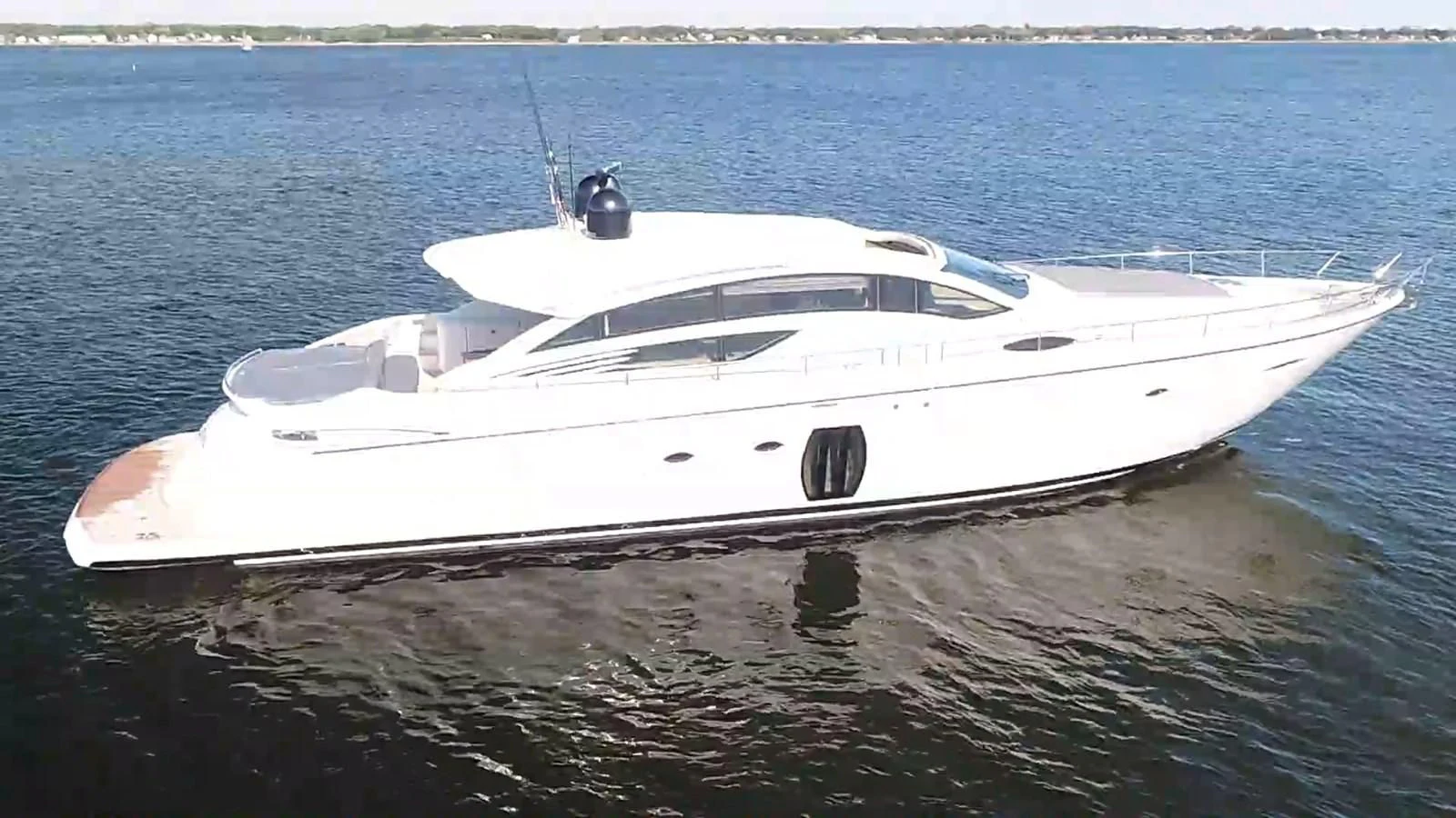 a white boat in the water aboard UPTOWN GIRL Yacht for Sale
