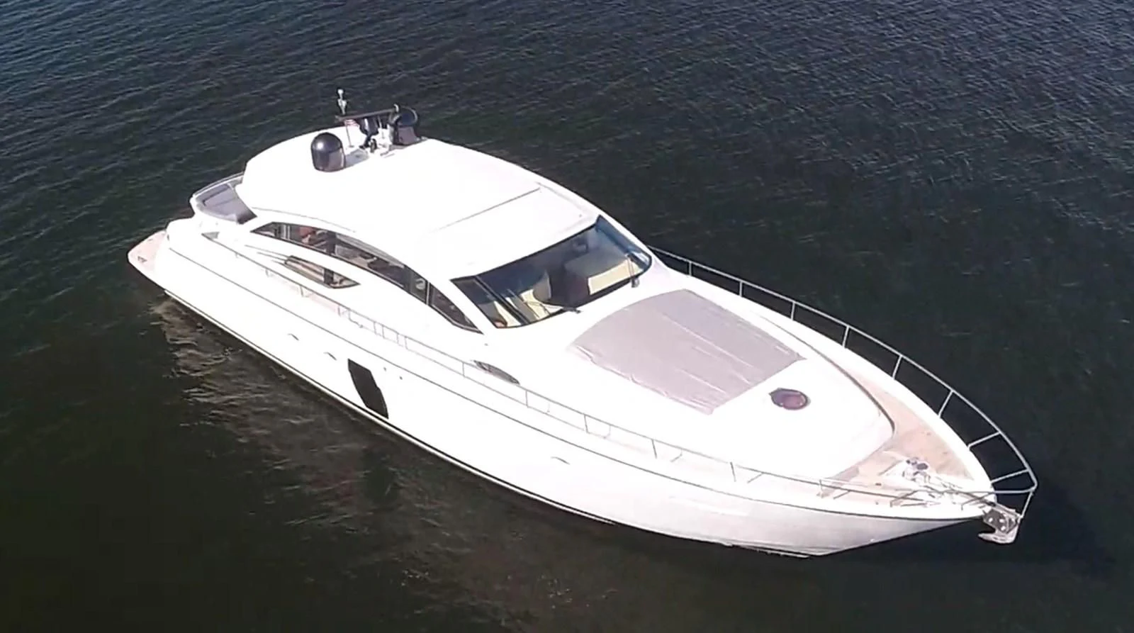 a white boat on the water aboard UPTOWN GIRL Yacht for Sale