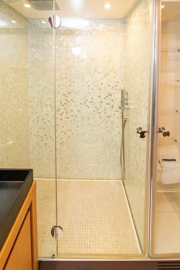 a bathroom with a glass shower aboard UPTOWN GIRL Yacht for Sale