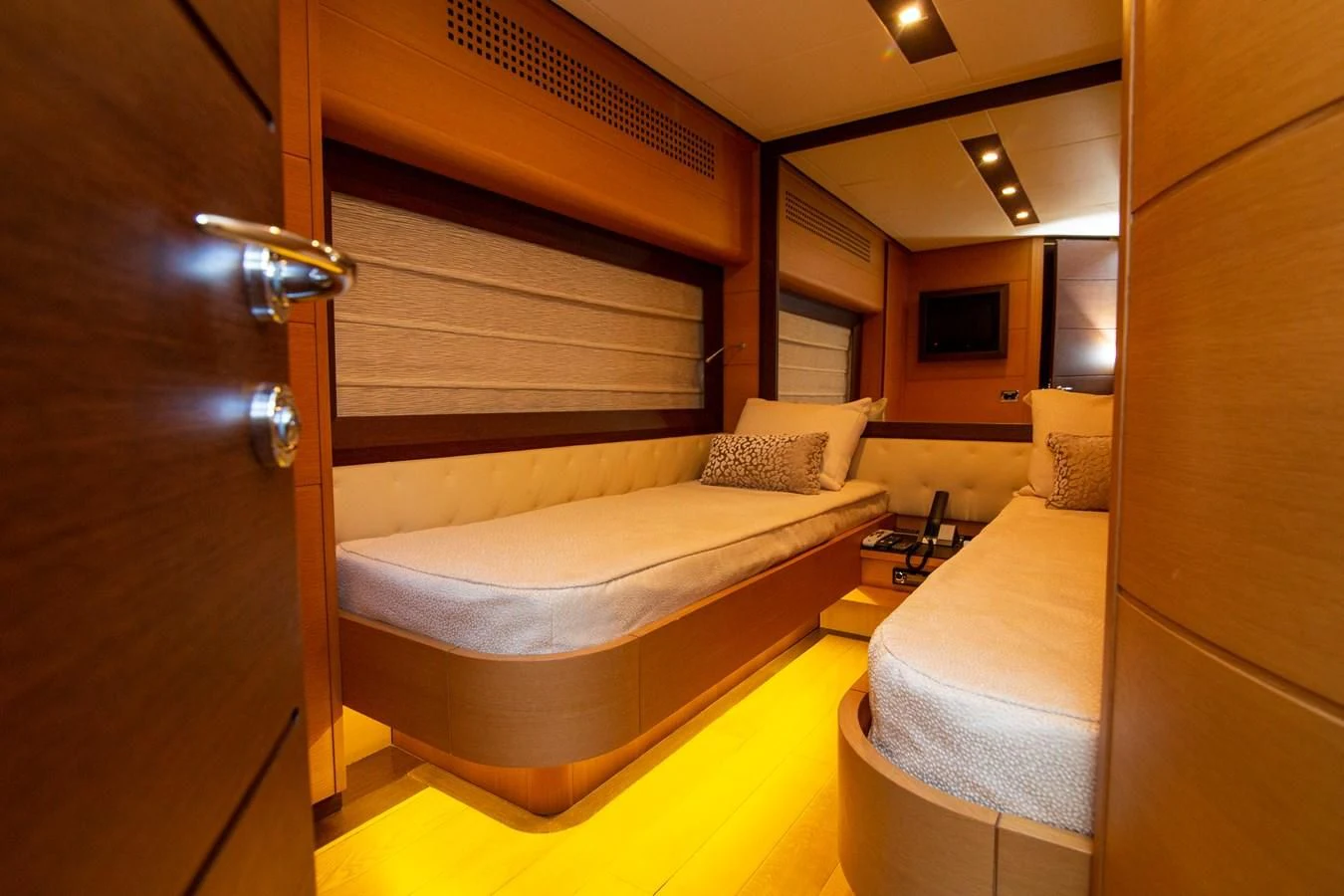 a room with a bed and a closet aboard UPTOWN GIRL Yacht for Sale